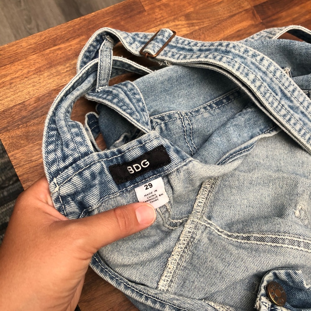 Overalls size 29. Fits like a medium.